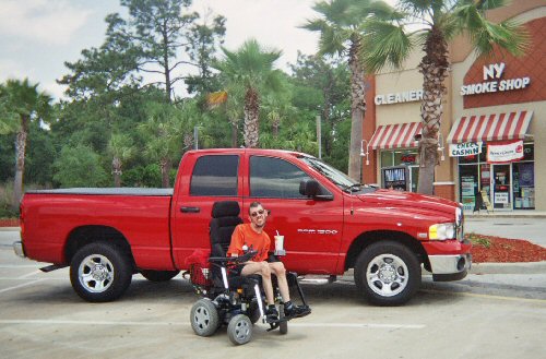 Me next to someone's huge pick-up truck in Orlando, Florida.
